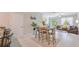 Open concept dining room and living room area with large windows at 607 Royal Empress Dr, Ruskin, FL 33570