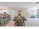 Bright dining area featuring a wooden table, stylish decor, and neutral walls at 607 Royal Empress Dr, Ruskin, FL 33570