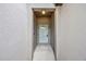A close up of the front entrance with a secure white door at 607 Royal Empress Dr, Ruskin, FL 33570