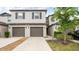 Attractive two-story townhouse featuring a private garage and neutral-toned exterior at 607 Royal Empress Dr, Ruskin, FL 33570