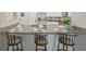 Kitchen featuring granite countertops, stainless steel appliances, and counter seating at 607 Royal Empress Dr, Ruskin, FL 33570