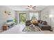 Bright living room with tile floors, comfortable seating, and natural light at 607 Royal Empress Dr, Ruskin, FL 33570