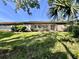 Expansive backyard with a covered patio, perfect for outdoor living at 610 S Woodlands Dr, Oldsmar, FL 34677