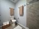Updated bathroom features tiled shower and neutral paint at 610 S Woodlands Dr, Oldsmar, FL 34677