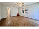 Spacious bedroom features hardwood floors, and view to the bath at 610 S Woodlands Dr, Oldsmar, FL 34677