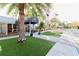 Inviting clubhouse entrance with well-maintained landscaping, flags, and walkway, showcasing the community's amenities at 610 S Woodlands Dr, Oldsmar, FL 34677