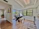 Bright dining room area with large windows and sliding glass door to outdoor patio at 610 S Woodlands Dr, Oldsmar, FL 34677