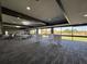 A neutral carpeted event space with abundant natural light and views of the golf course at 610 S Woodlands Dr, Oldsmar, FL 34677