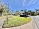 Attractive community featuring well-manicured lawns and covered parking at 610 S Woodlands Dr, Oldsmar, FL 34677