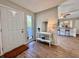 Welcoming foyer features a console table with decor and views of the living area at 610 S Woodlands Dr, Oldsmar, FL 34677