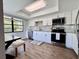Updated kitchen features stainless steel appliances and mosaic backsplash at 610 S Woodlands Dr, Oldsmar, FL 34677