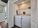 Convenient indoor laundry room with washer and dryer at 610 S Woodlands Dr, Oldsmar, FL 34677