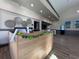 The clubhouse lobby area has a reception desk, and decorations at 610 S Woodlands Dr, Oldsmar, FL 34677