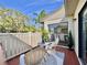 Cozy patio featuring seating, a small table, and outdoor decor, perfect for relaxation at 610 S Woodlands Dr, Oldsmar, FL 34677