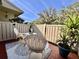 Inviting outdoor patio with a decorative rug, comfortable seating, and a view of the backyard at 610 S Woodlands Dr, Oldsmar, FL 34677