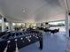 View of the indoor recreation area with a foosball table, lounge seating, and tables at 610 S Woodlands Dr, Oldsmar, FL 34677