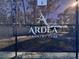 Tennis court showcasing the community's amenities, featuring the Ardea Country Club logo on the net at 610 S Woodlands Dr, Oldsmar, FL 34677
