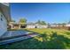 Spacious backyard with a wooden deck and lawn plus a carport at 6316 S Richard Ave, Tampa, FL 33616