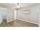 Bedroom with vinyl floors and a walk-in closet with installed shelving at 6316 S Richard Ave, Tampa, FL 33616