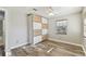Bedroom including a built-in wardrobe, vinyl floors and neutral colored walls at 6316 S Richard Ave, Tampa, FL 33616