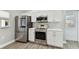 Bright, updated kitchen with stainless steel appliances, sleek countertops, and modern white cabinets at 6316 S Richard Ave, Tampa, FL 33616