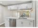 Well-equipped kitchen with modern appliances and a pass-through to the dining area at 6316 S Richard Ave, Tampa, FL 33616