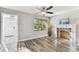 Sunlit living room with wood-look floors and decorative fireplace at 6316 S Richard Ave, Tampa, FL 33616