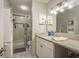 Bathroom featuring a sink vanity with white cabinets, countertop and a shower-tub combination at 6475 23Rd N St, St Petersburg, FL 33702