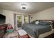 Cozy bedroom with a walkout balcony and relaxing exterior views at 6475 23Rd N St, St Petersburg, FL 33702