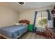 A cozy bedroom with a single bed, window, and chest of drawers at 6475 23Rd N St, St Petersburg, FL 33702