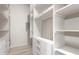 Spacious walk-in closet with built-in shelving and drawers for optimal organization at 6475 23Rd N St, St Petersburg, FL 33702