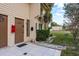 Exterior view of townhome with lawn, tidy landscaping, and a neutral-colored exterior at 6475 23Rd N St, St Petersburg, FL 33702