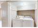 Efficient laundry area features a side-by-side washer and dryer for convenient chores at 6475 23Rd N St, St Petersburg, FL 33702
