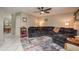 Inviting living room with tile floors, neutral walls, ceiling fan, and a comfortable sectional sofa at 6475 23Rd N St, St Petersburg, FL 33702