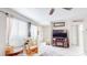 Cozy living room featuring tile floors, a rocking chair, natural light, and a TV with stand at 6475 23Rd N St, St Petersburg, FL 33702