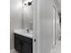 Well-lit half bathroom featuring modern fixtures and a sleek vanity at 6709 Lake Rochester Ln, Gibsonton, FL 33534