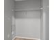 Walk-in closet featuring one wire shelf and carpeted floor at 6709 Lake Rochester Ln, Gibsonton, FL 33534