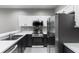 Modern kitchen showcasing stainless steel appliances, white countertops, and stylish cabinetry at 6709 Lake Rochester Ln, Gibsonton, FL 33534