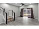 Bright living room featuring hardwood flooring, a ceiling fan, and sliding glass doors at 6709 Lake Rochester Ln, Gibsonton, FL 33534