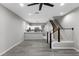 Open-concept living space combining kitchen and living room with modern finishes and natural light at 6709 Lake Rochester Ln, Gibsonton, FL 33534