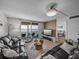Spacious living room with water views, balcony, and modern decor at 7910 Sun Island S Dr # 301, South Pasadena, FL 33707