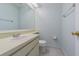 Clean bathroom featuring tiled floor, a vanity with sink, and a toilet with a white seat at 8335 Paddlewheel St, Tampa, FL 33637