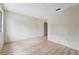 Bright empty bedroom features light floors, a window, and a door providing a canvas for comfortable living at 8419 Laurelon Pl, Temple Terrace, FL 33637