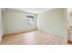 Bright, airy bedroom with light-colored walls, wood-look flooring, and natural light at 8419 Laurelon Pl, Temple Terrace, FL 33637