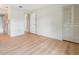 Bedroom with closet, light walls, wood-look floors, and access to bathroom at 8419 Laurelon Pl, Temple Terrace, FL 33637