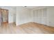 Empty bedroom featuring light wood floors, closet and neutral paint creating a versatile living space at 8419 Laurelon Pl, Temple Terrace, FL 33637
