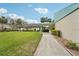 Inviting one story home showcasing a well maintained lawn and colorful, mature landscaping at 8419 Laurelon Pl, Temple Terrace, FL 33637