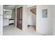 Hallway with wooden closet door located near the kitchen at 8419 Laurelon Pl, Temple Terrace, FL 33637