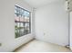 A spacious room featuring neutral walls and a large window at 8419 Laurelon Pl, Temple Terrace, FL 33637