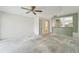 View of a room showing ceiling fan, closet, and kitchen pass through at 8419 Laurelon Pl, Temple Terrace, FL 33637